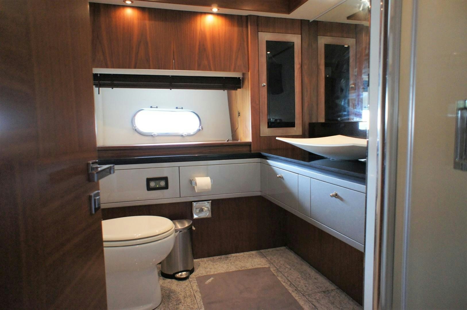 a bathroom with a sink and toilet aboard SYDNEY Yacht for Sale