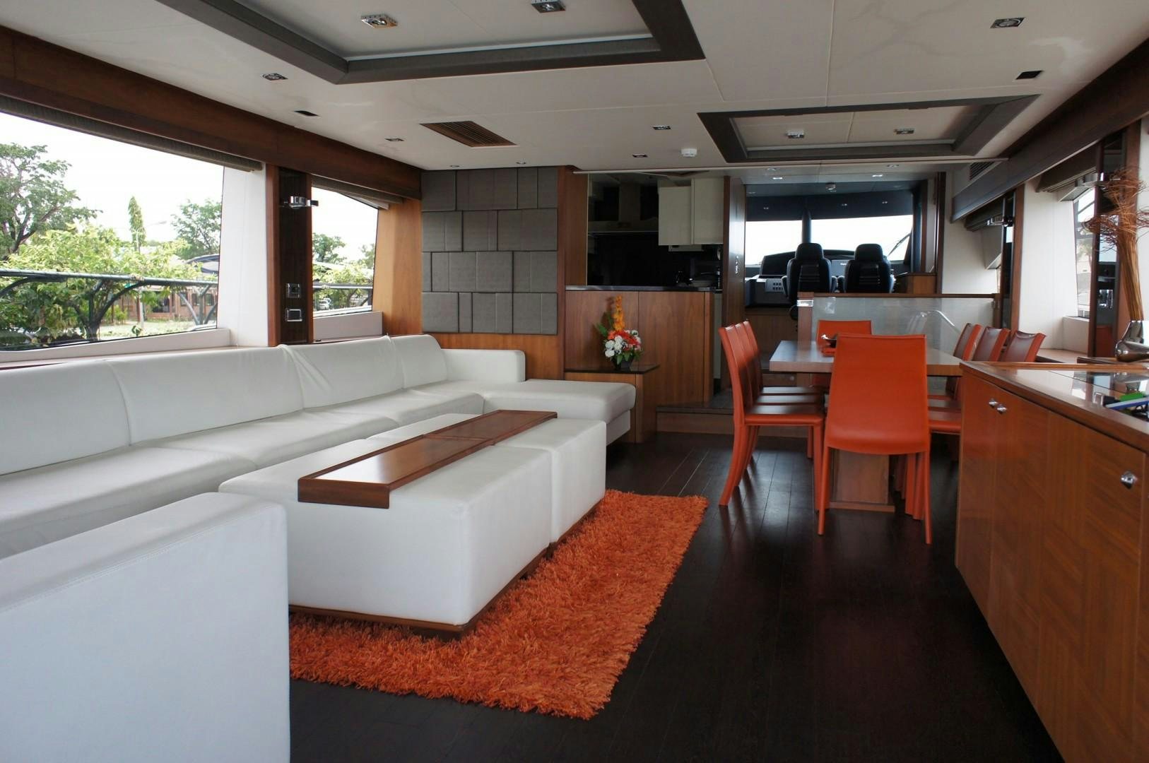 a living room with a couch and a table aboard SYDNEY Yacht for Sale