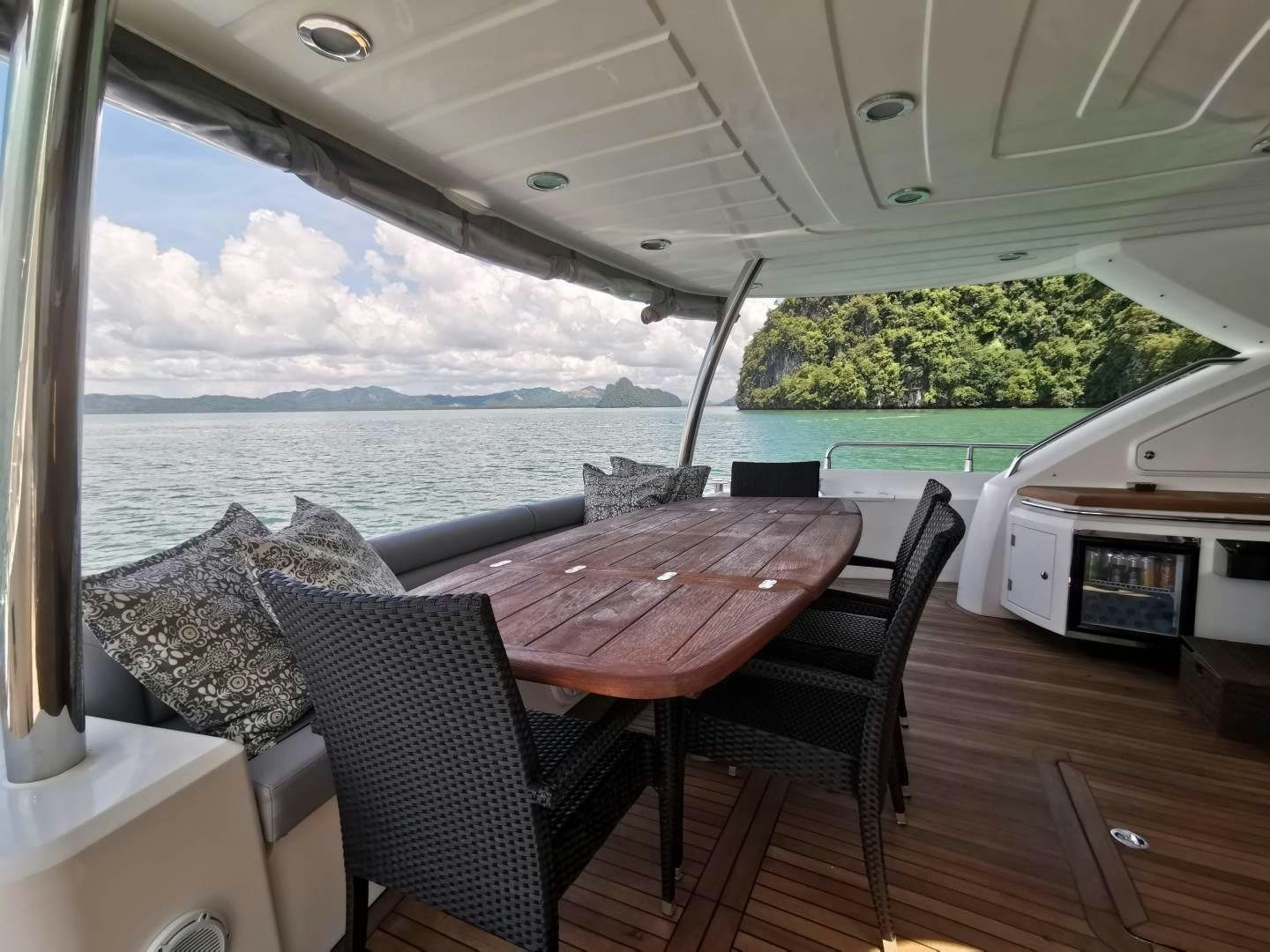 a table and chairs on a boat aboard SYDNEY Yacht for Sale