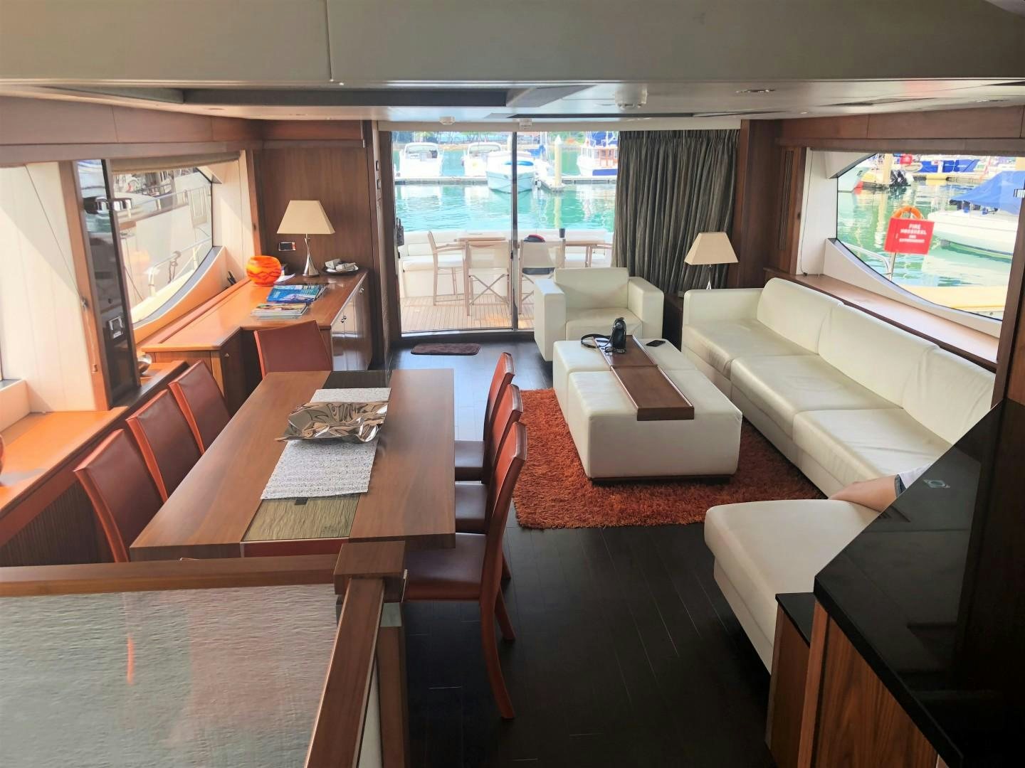 a living room with a large screen aboard SYDNEY Yacht for Sale