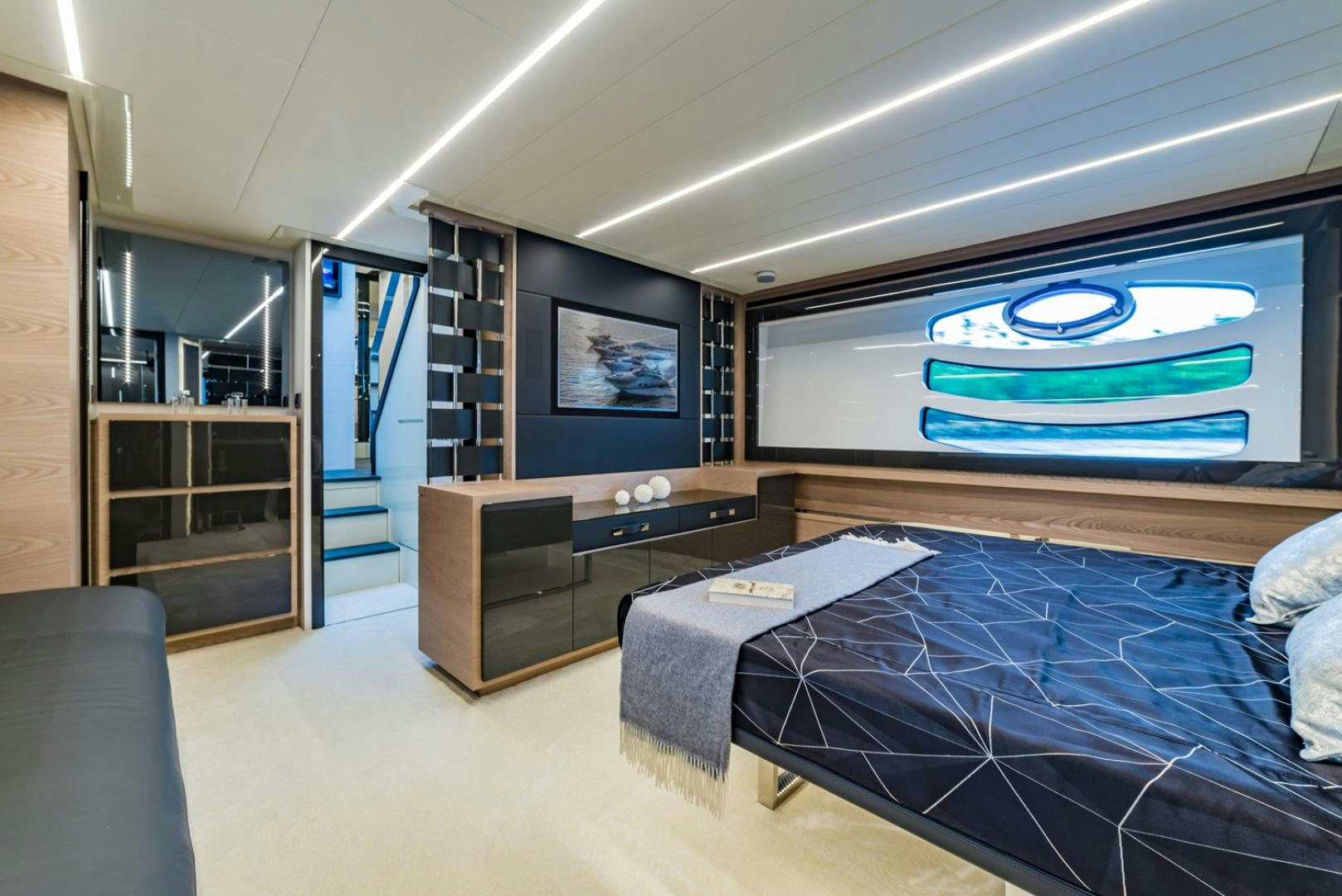 a room with a bed and a tv aboard BAD DADDY Yacht for Sale