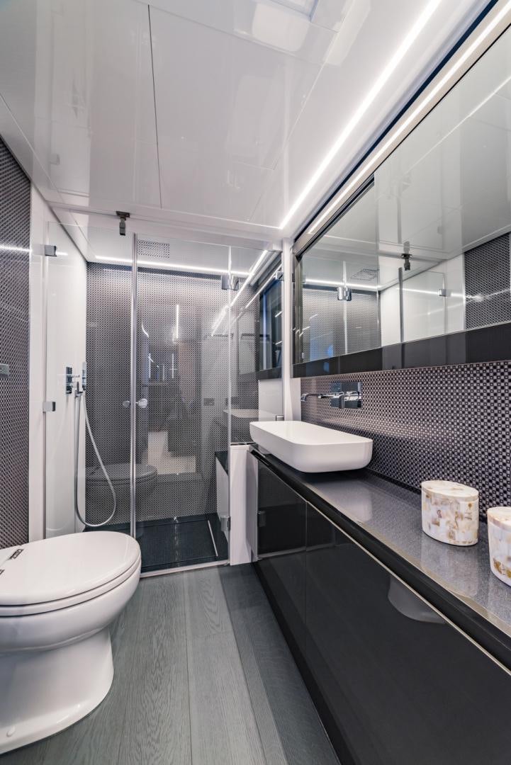 a bathroom with a glass shower aboard BAD DADDY Yacht for Sale