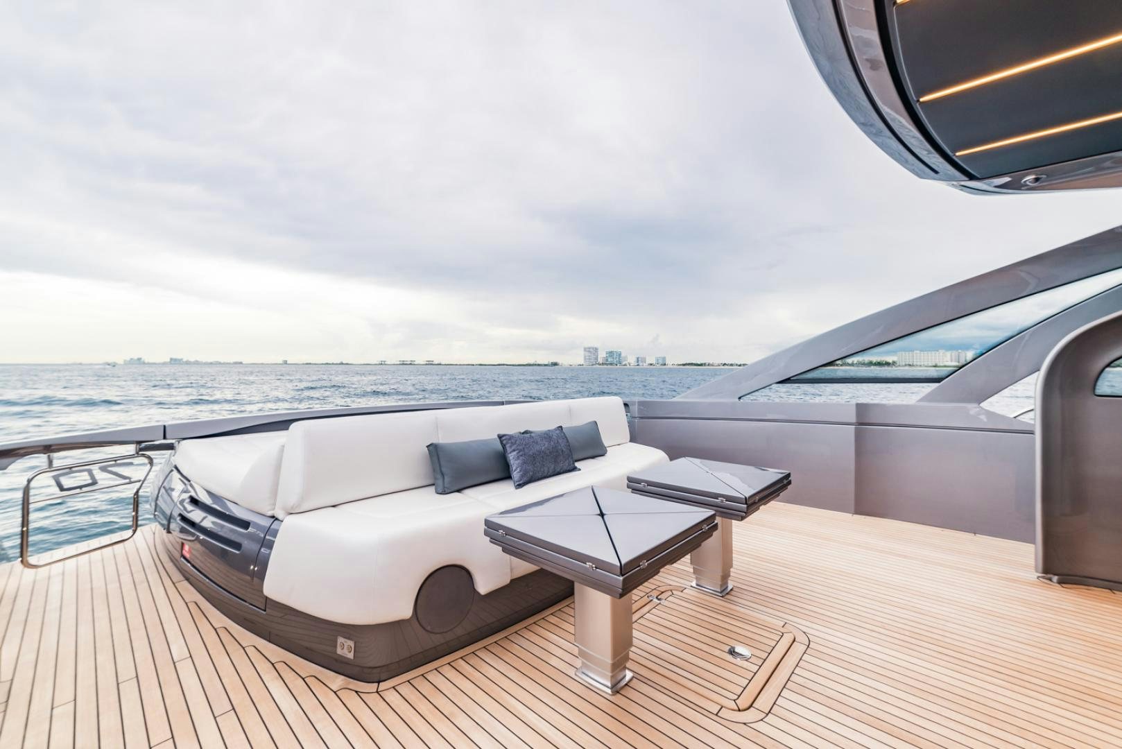 a couch on a deck overlooking a body of water aboard BAD DADDY Yacht for Sale