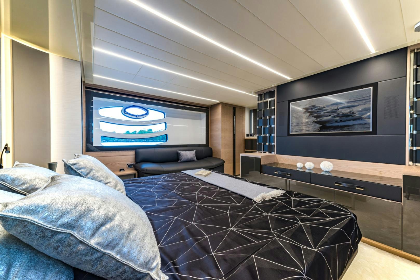 a bedroom with a bed and a tv aboard BAD DADDY Yacht for Sale