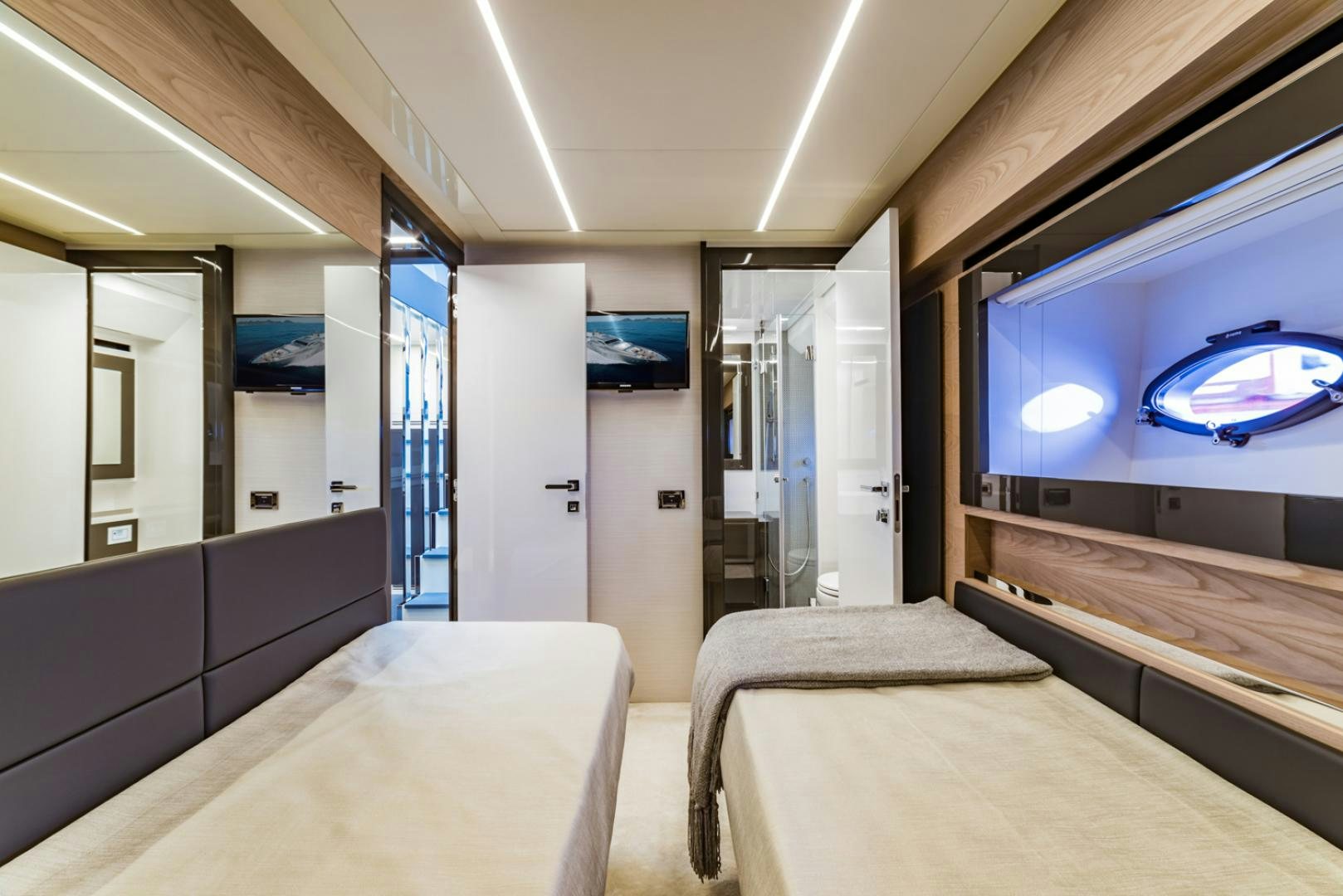 a room with a bed and a tv aboard BAD DADDY Yacht for Sale
