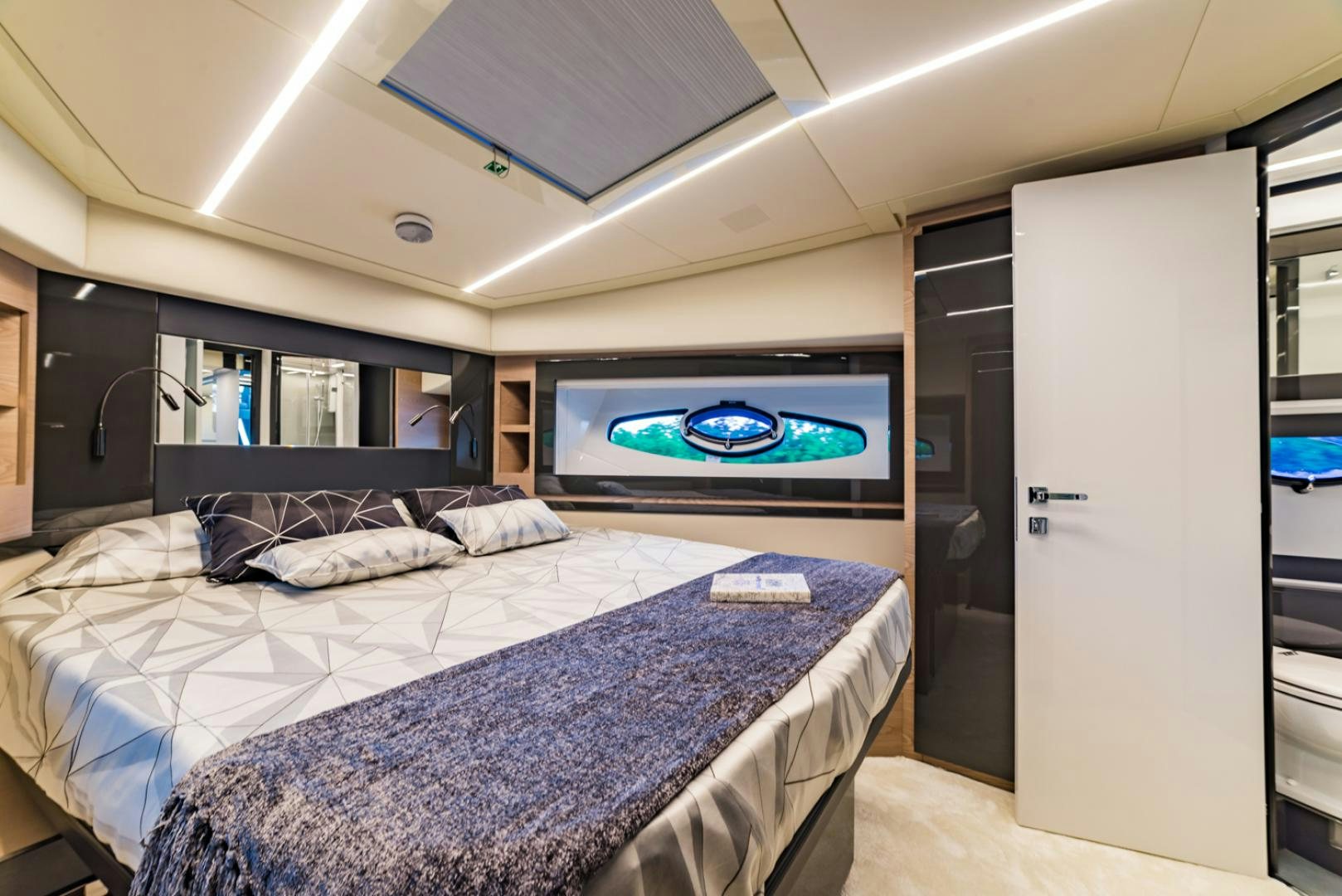 a bedroom with a large bed aboard BAD DADDY Yacht for Sale