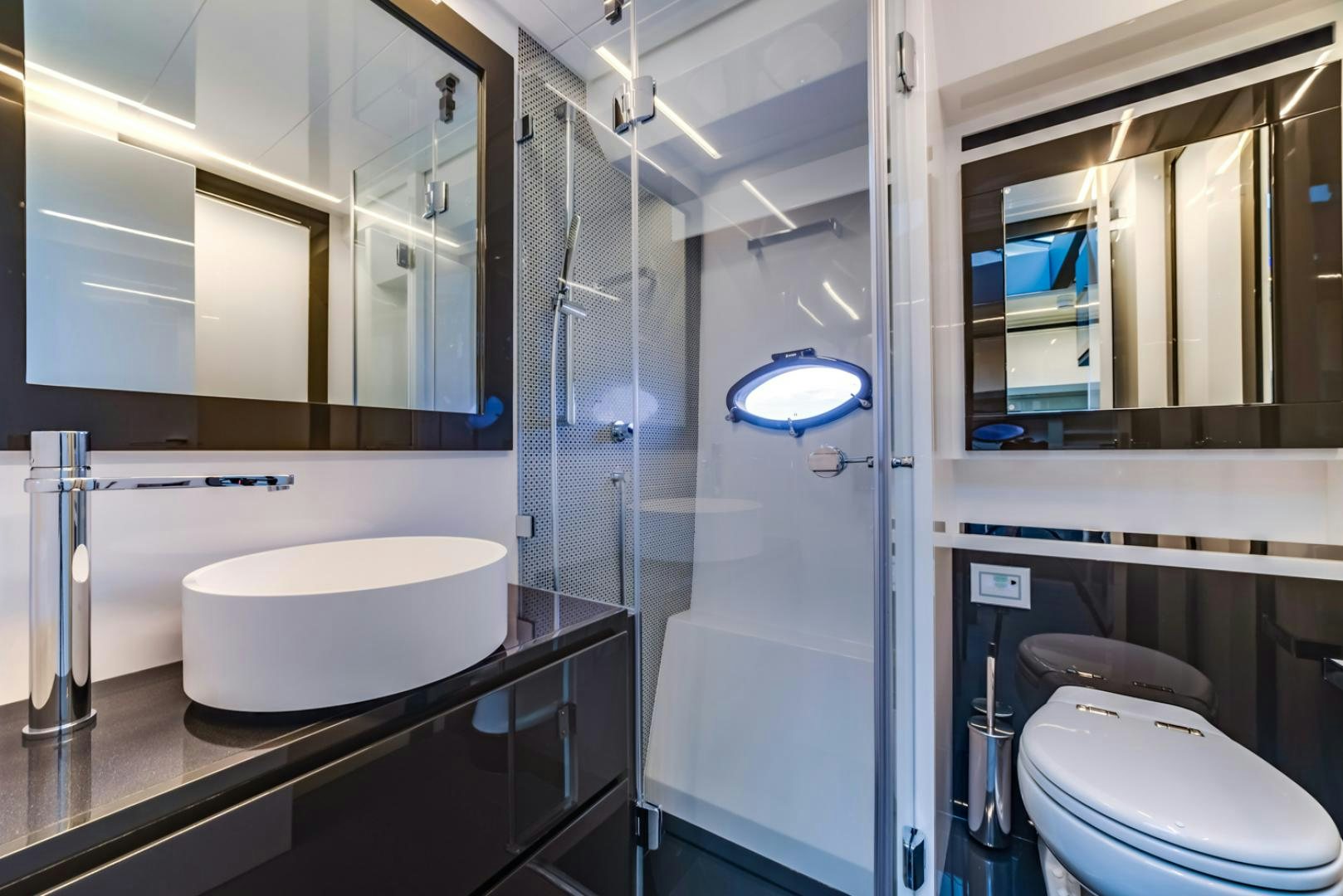 a bathroom with a glass shower aboard BAD DADDY Yacht for Sale