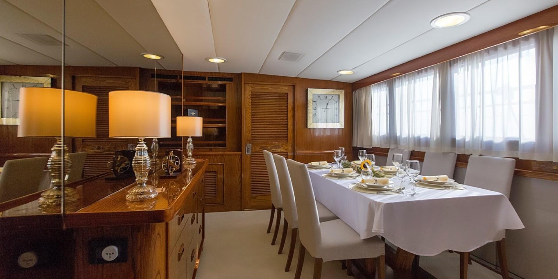 a room with tables and chairs aboard ADRIATIC ESCAPE Yacht for Sale