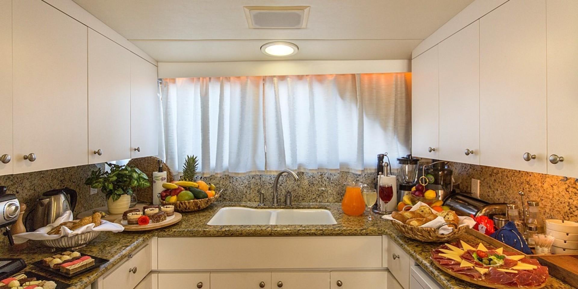 a kitchen with white cabinets aboard ADRIATIC ESCAPE Yacht for Sale