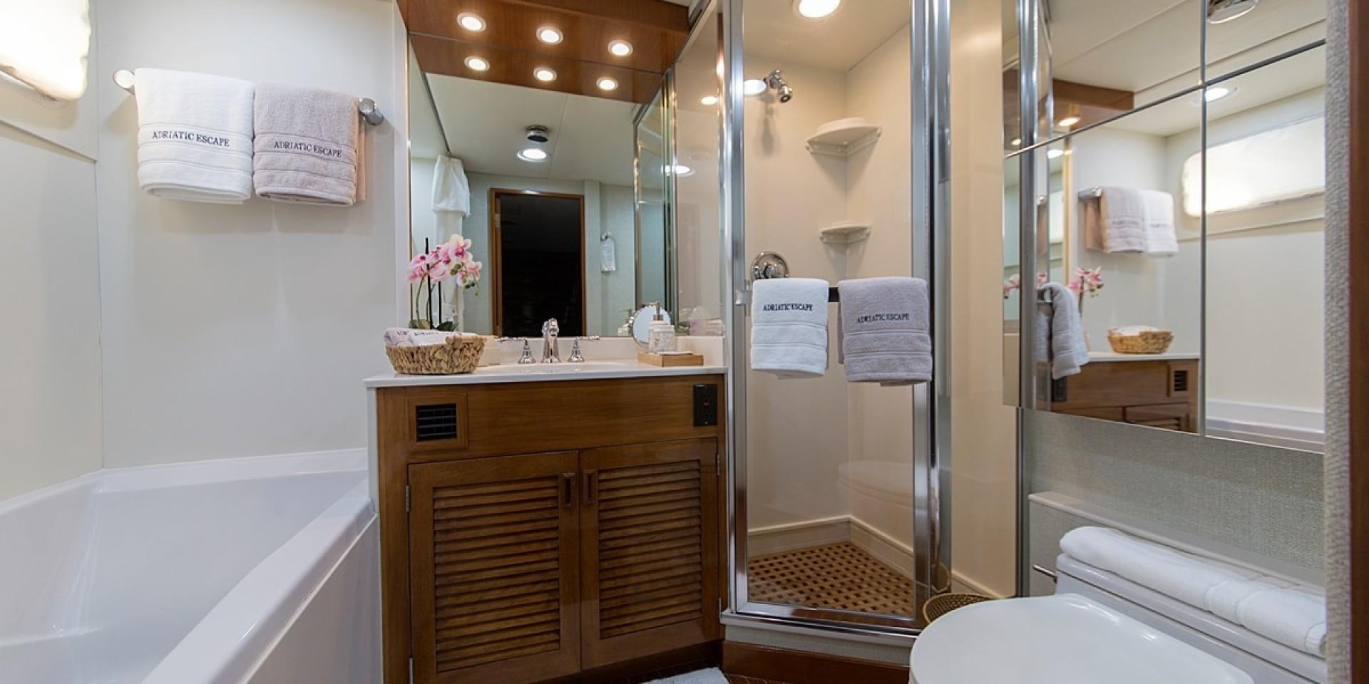 a bathroom with a glass shower aboard ADRIATIC ESCAPE Yacht for Sale