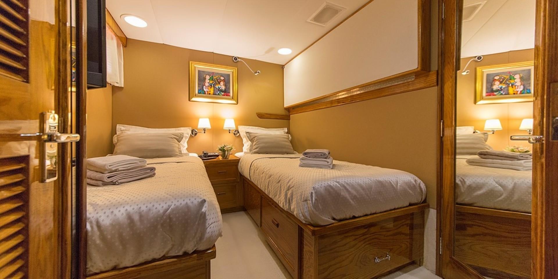 a room with a bed and a mirror aboard ADRIATIC ESCAPE Yacht for Sale
