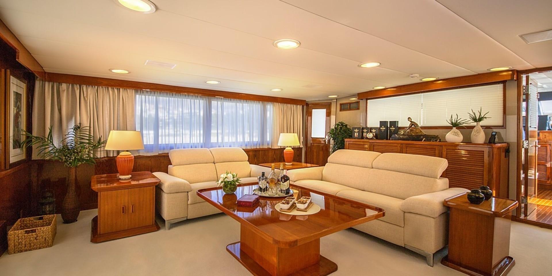 a living room with a couch and a coffee table aboard ADRIATIC ESCAPE Yacht for Sale