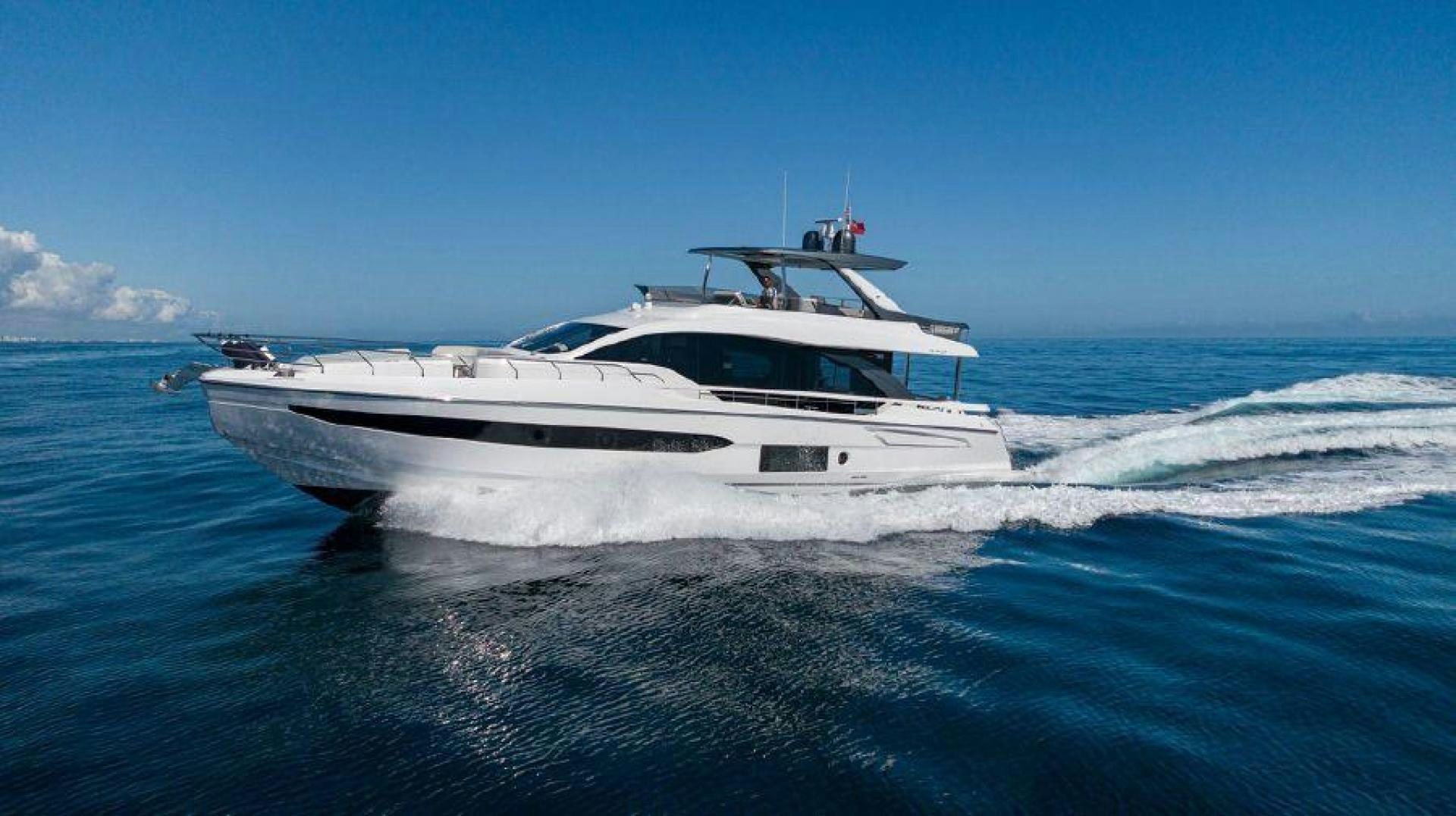 a white yacht on the water aboard SUN LIFE Yacht for Sale