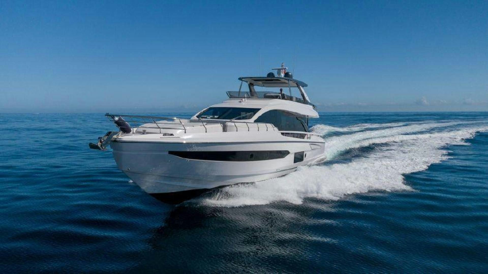 a white yacht on the water aboard SUN LIFE Yacht for Sale