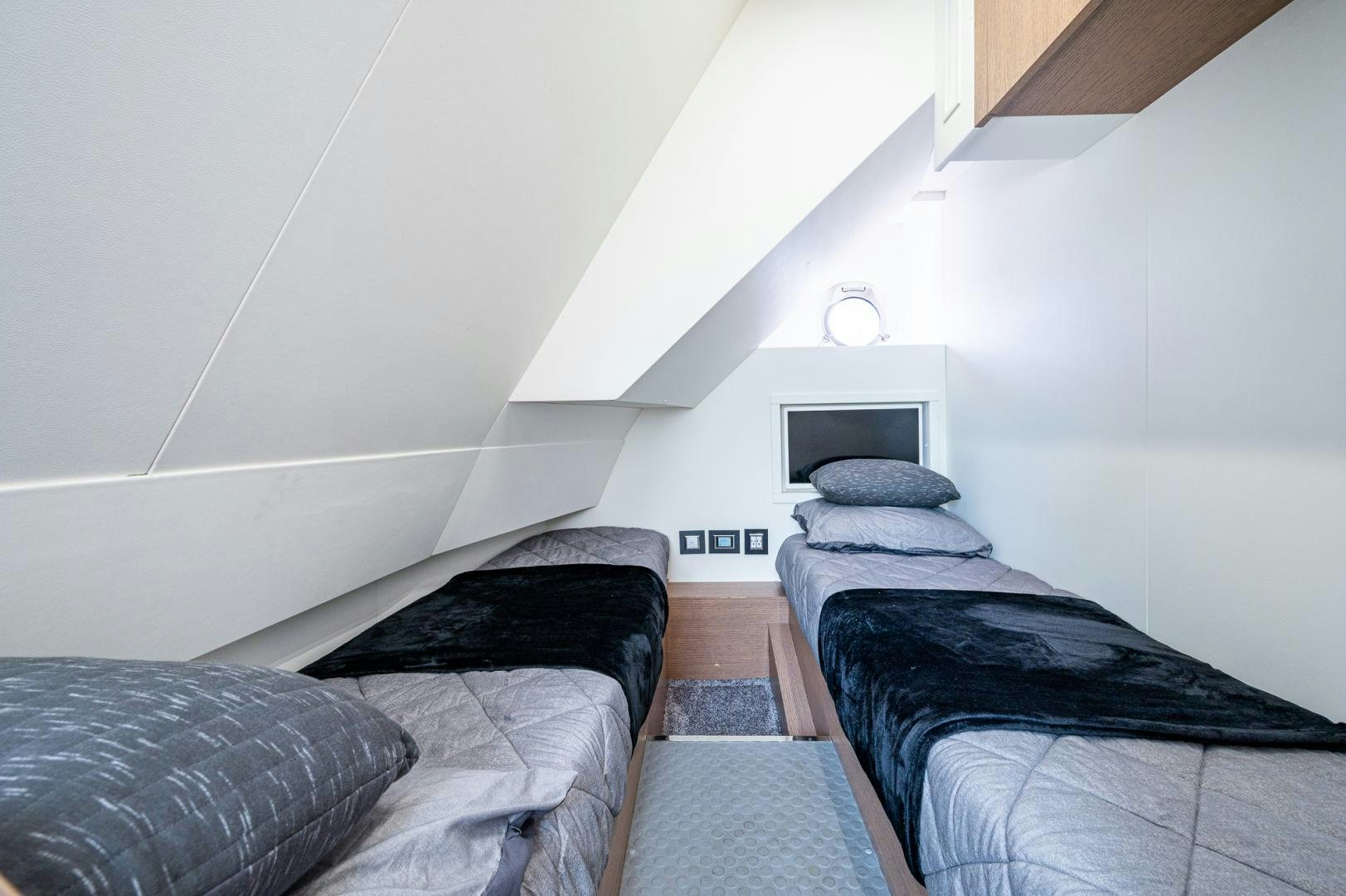 a room with two beds aboard LEBRADA Yacht for Sale