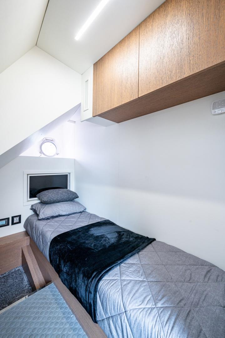 a bed in a room aboard LEBRADA Yacht for Sale