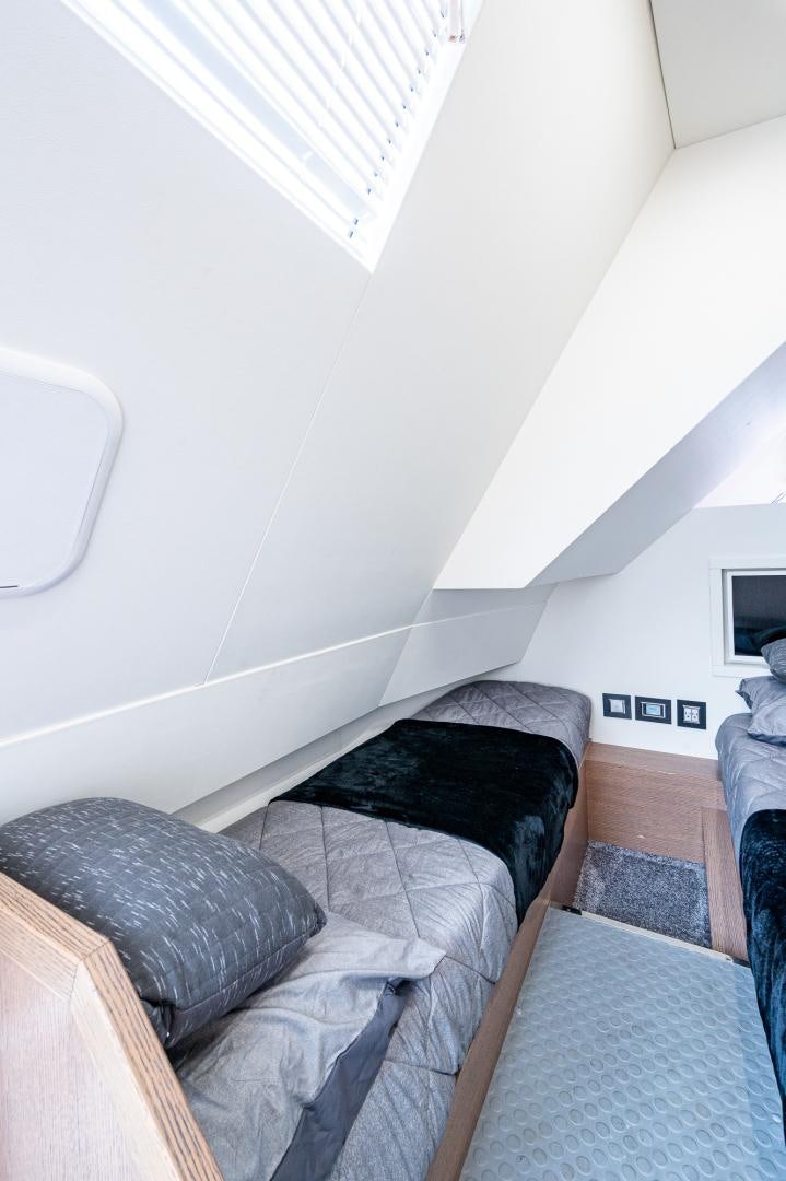 a room with a bed and a couch aboard LEBRADA Yacht for Sale