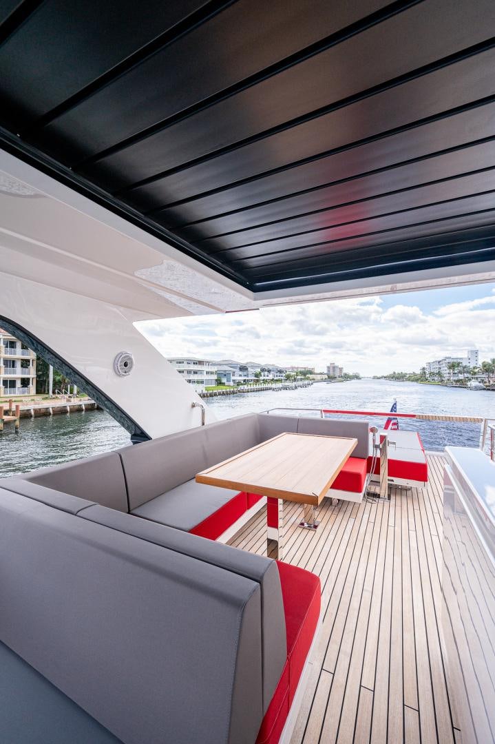 a deck with a view of the water and a city aboard LEBRADA Yacht for Sale