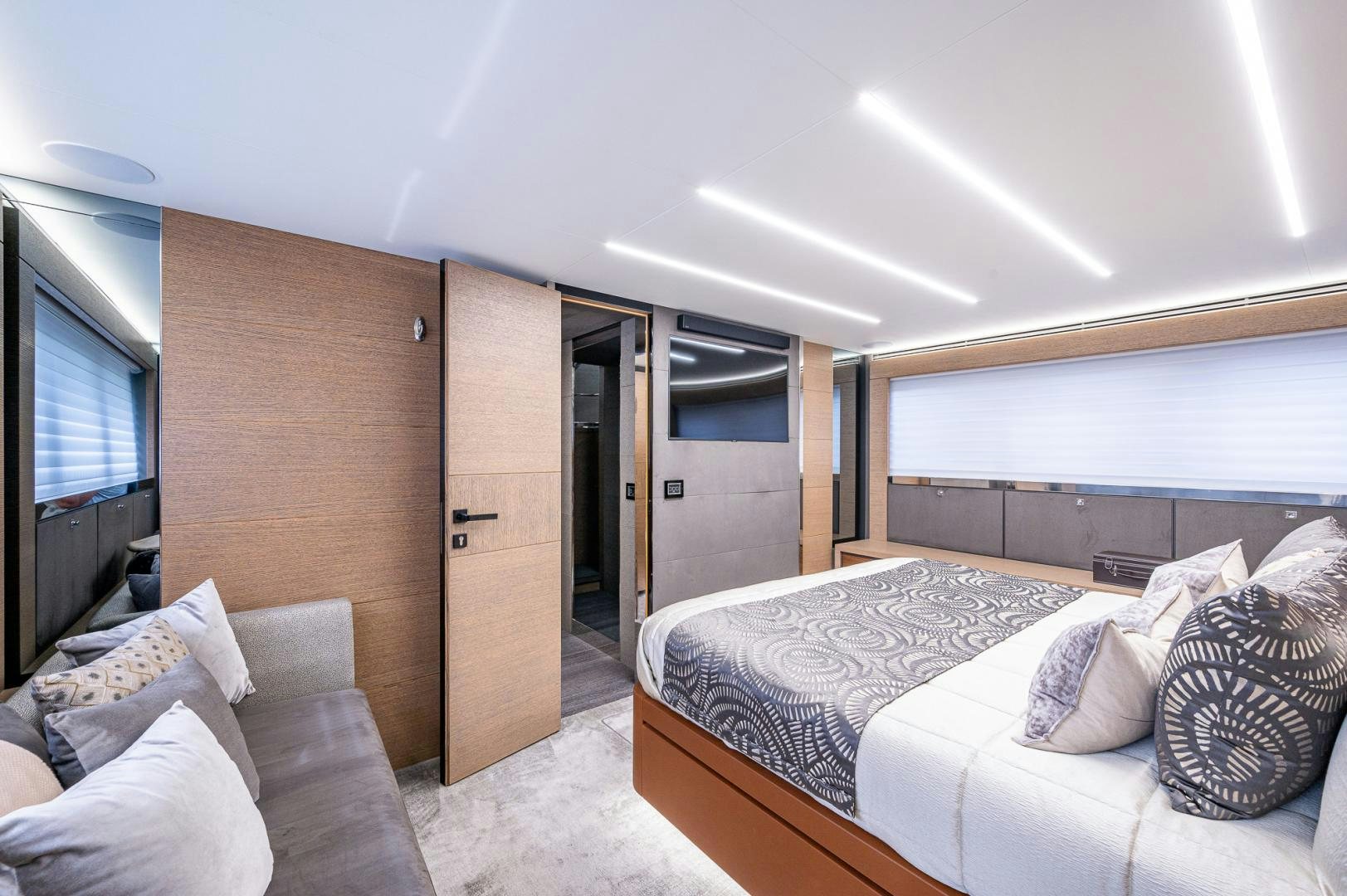 a bedroom with a bed and a television aboard LEBRADA Yacht for Sale