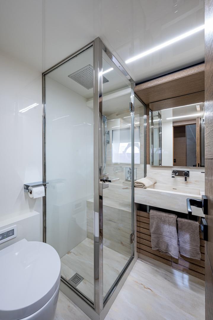 a bathroom with a glass shower aboard LEBRADA Yacht for Sale