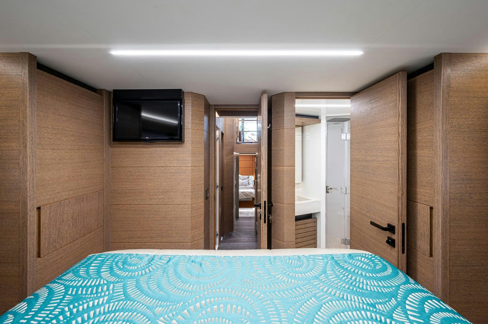 a room with a bed and a television aboard LEBRADA Yacht for Sale