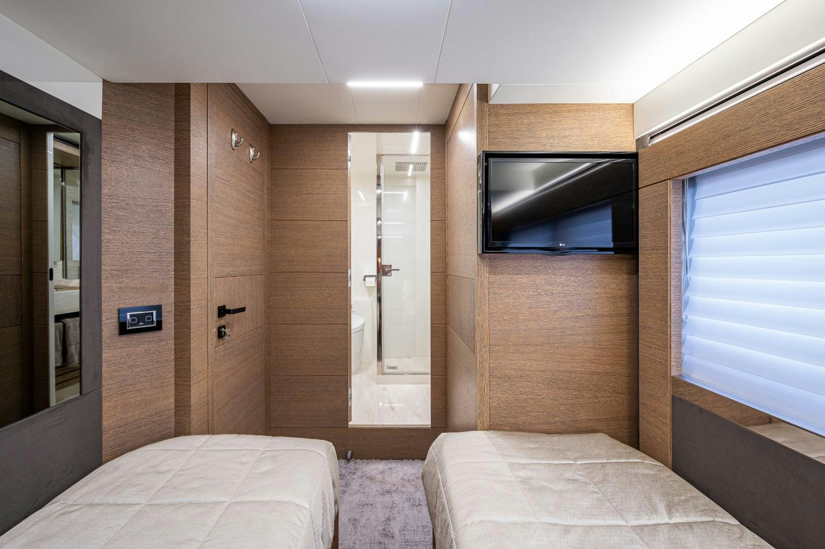 a room with a bed and a tv aboard LEBRADA Yacht for Sale