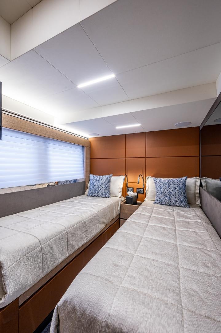 a room with two beds aboard LEBRADA Yacht for Sale