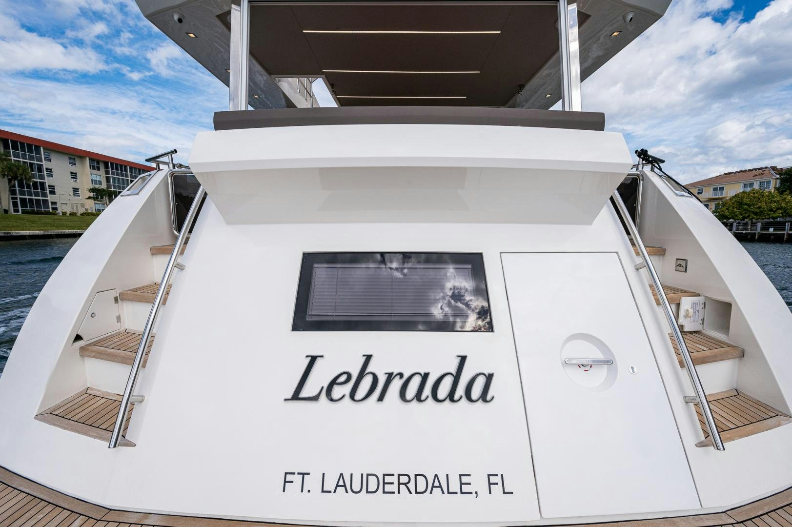 a white boat with a sign on it aboard LEBRADA Yacht for Sale