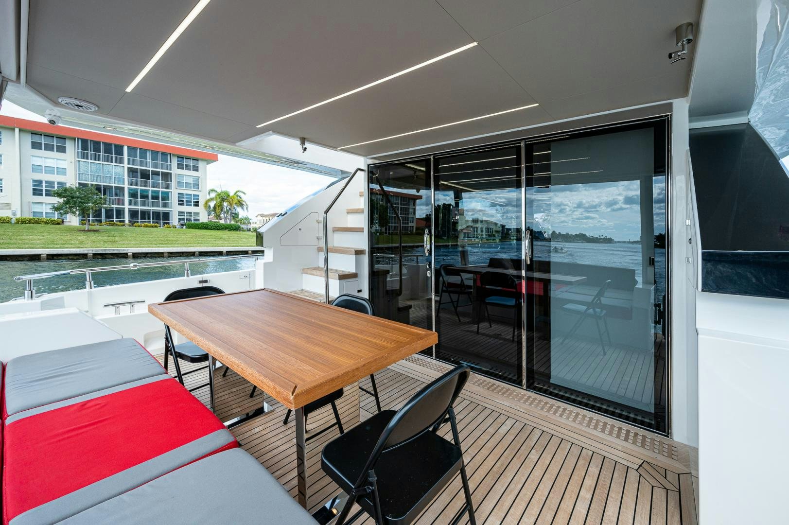 a room with a table and chairs aboard LEBRADA Yacht for Sale