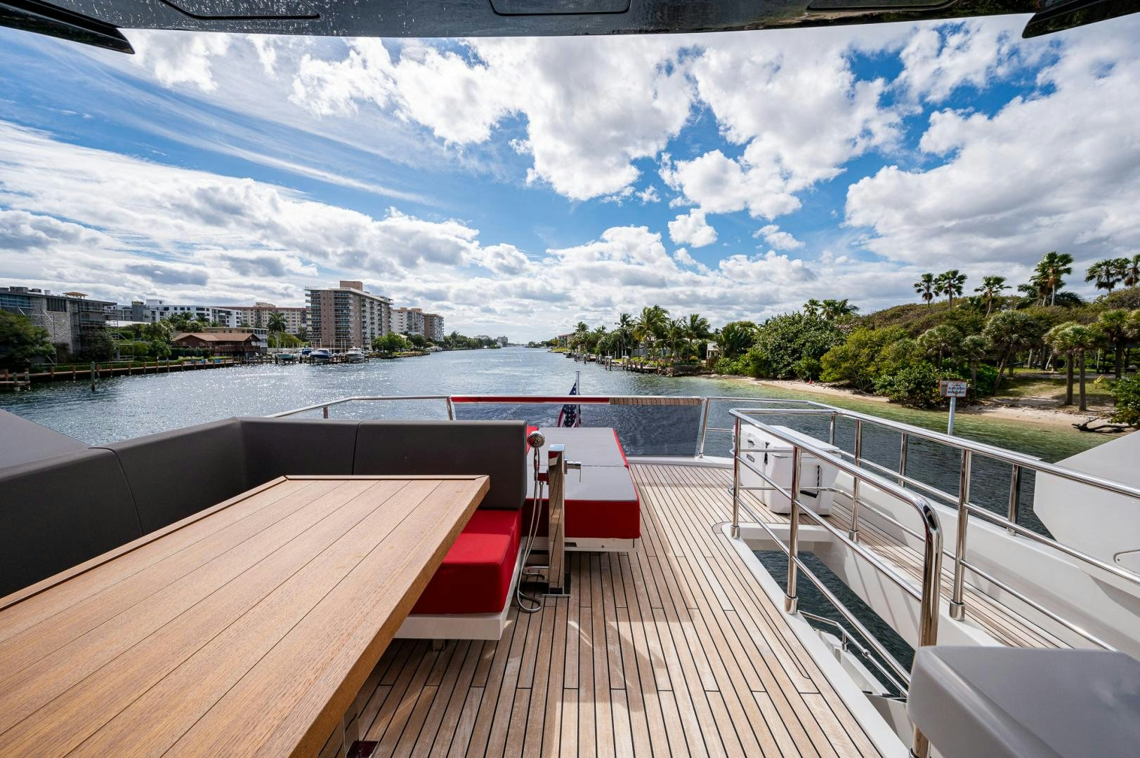 a deck with a view of a city and water aboard LEBRADA Yacht for Sale