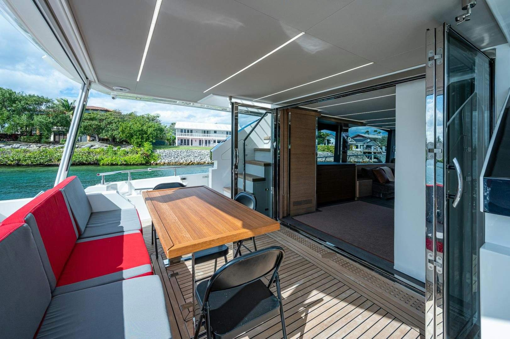 a room with a table and chairs aboard LEBRADA Yacht for Sale