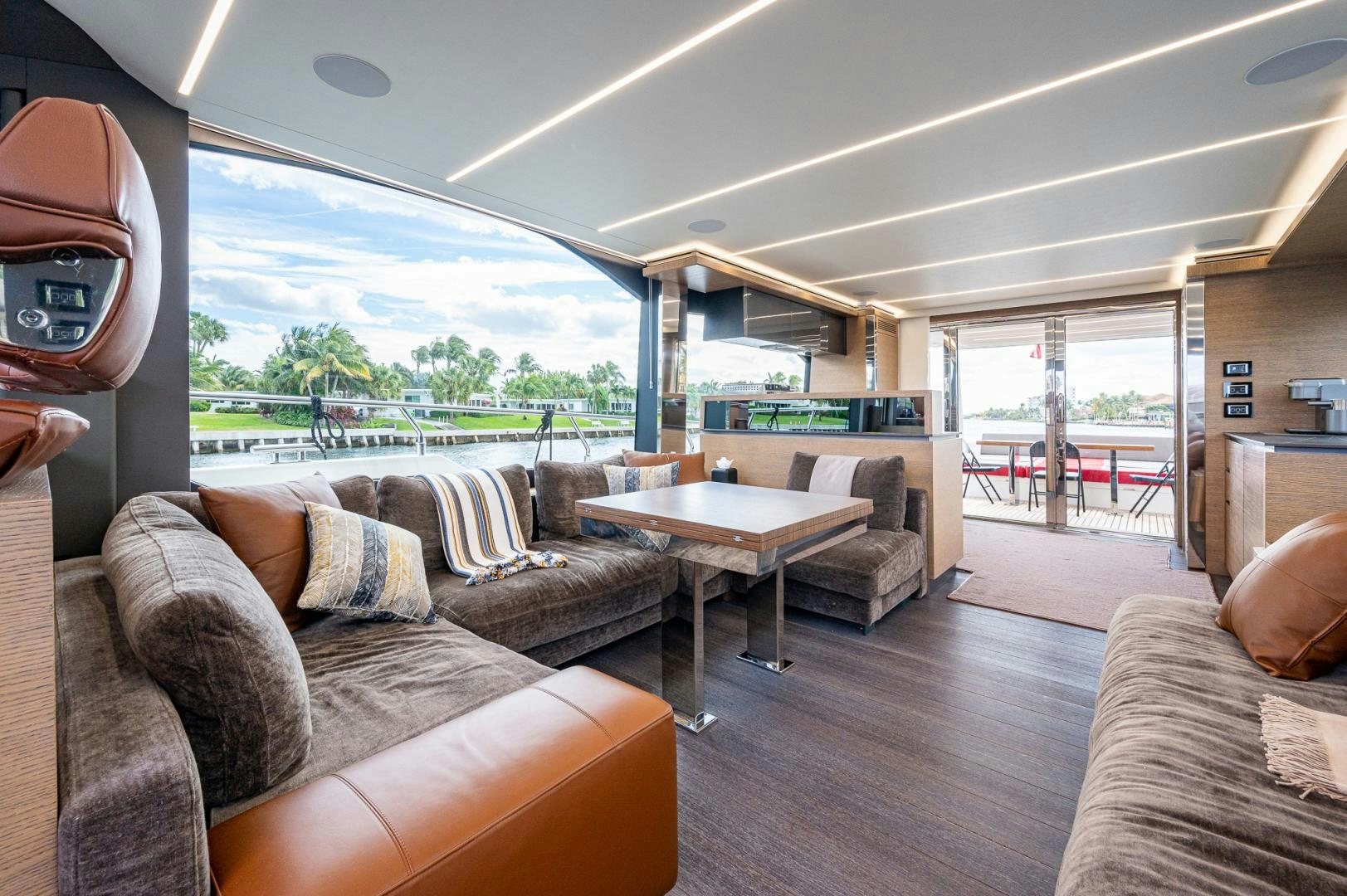 a living room with a large window aboard LEBRADA Yacht for Sale