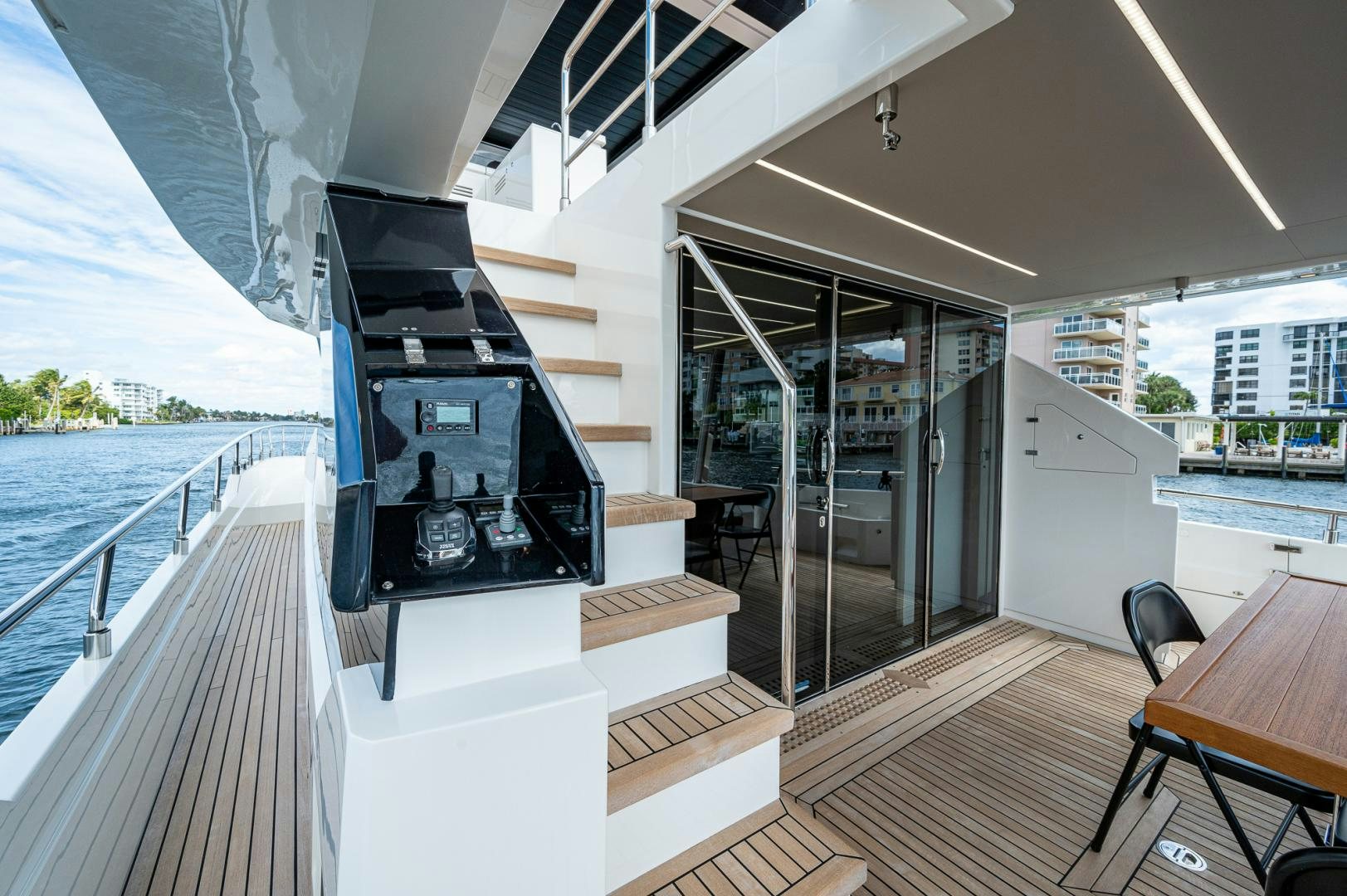 a room with a deck and a pool aboard LEBRADA Yacht for Sale