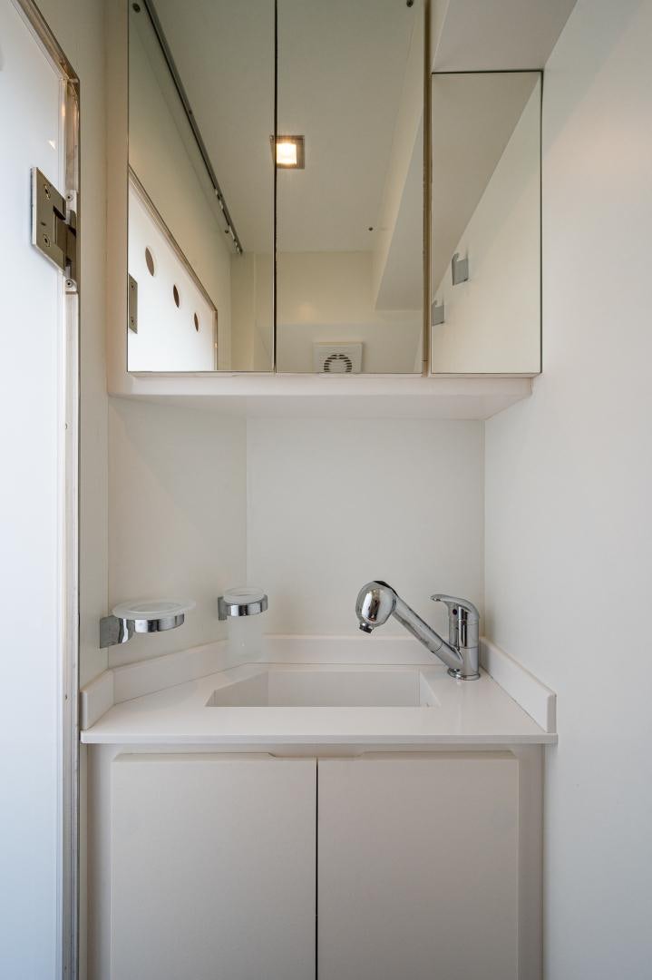 a bathroom with a sink and a mirror aboard LEBRADA Yacht for Sale