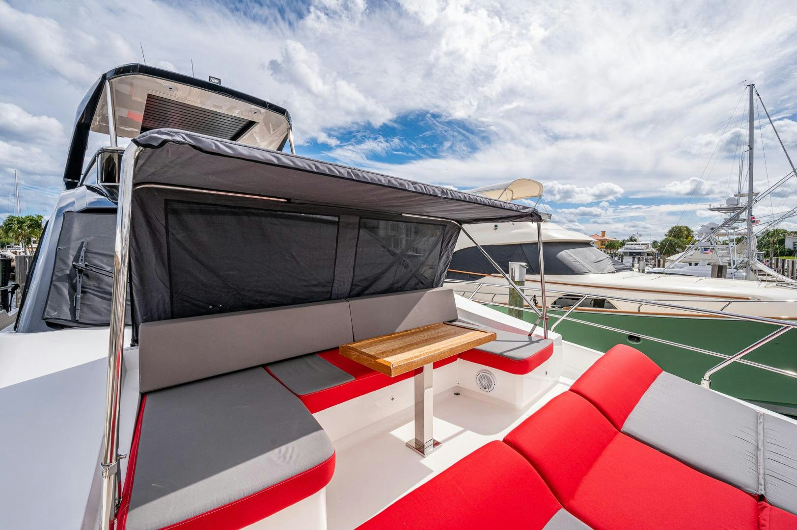 a boat with a red and white striped roof aboard LEBRADA Yacht for Sale