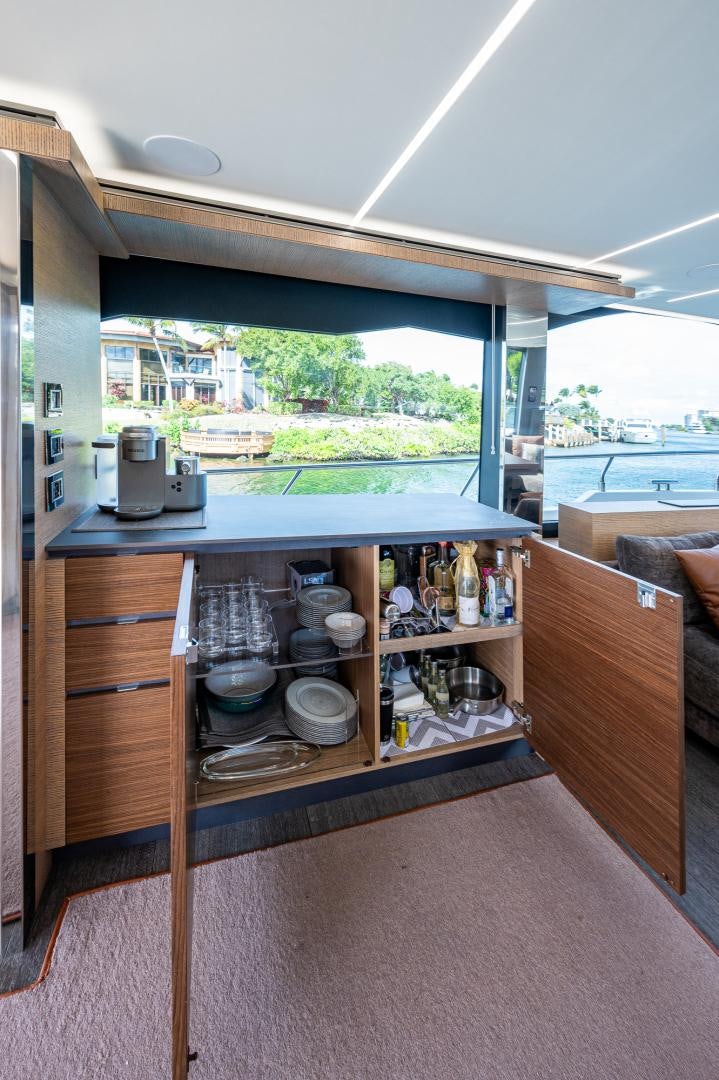 a kitchen with a large window aboard LEBRADA Yacht for Sale