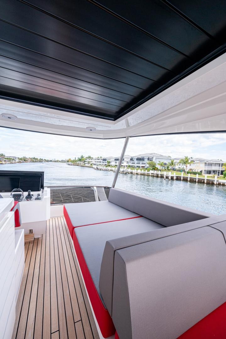 a deck with a deck and a body of water aboard LEBRADA Yacht for Sale