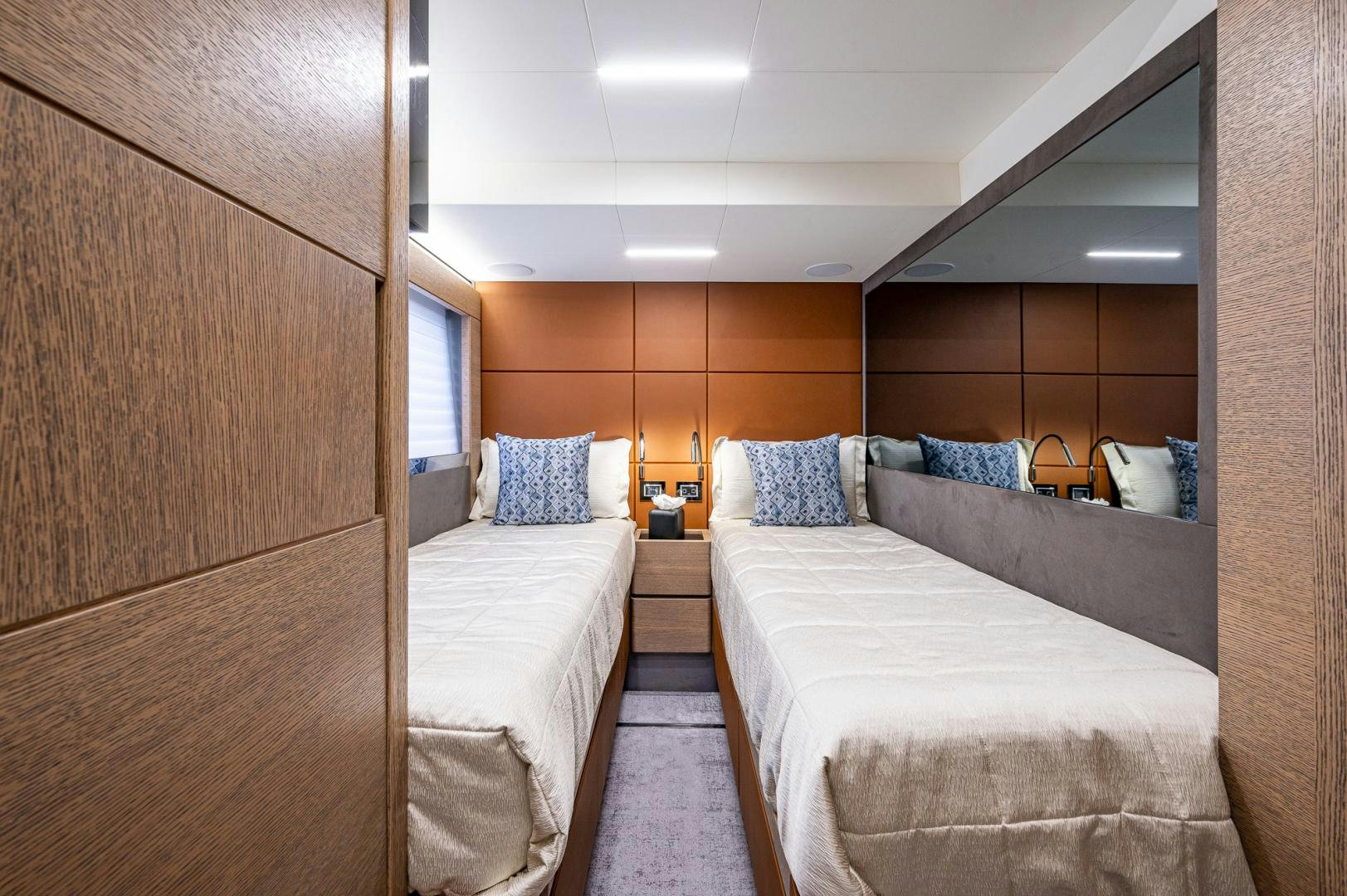 a room with two beds aboard LEBRADA Yacht for Sale