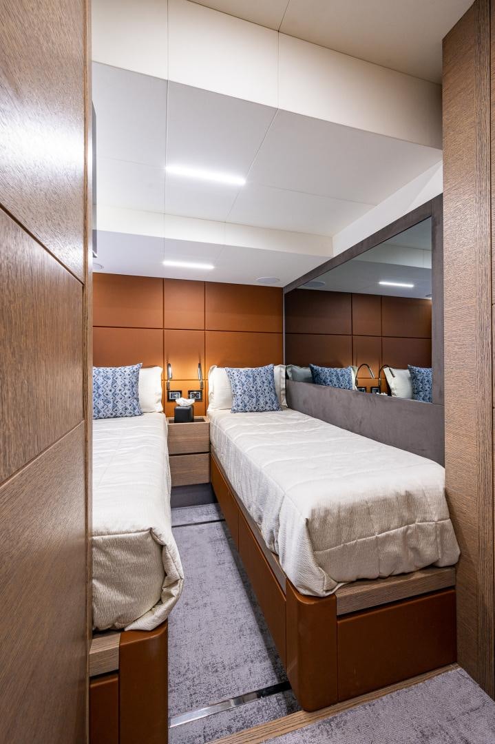 a room with two beds aboard LEBRADA Yacht for Sale