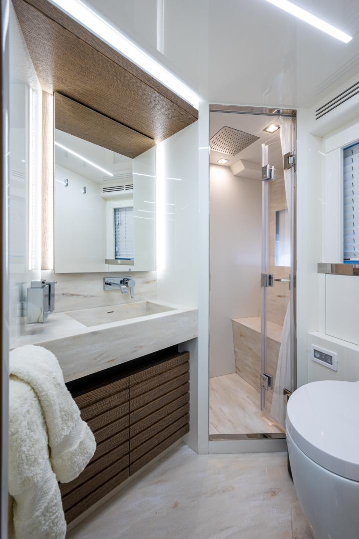 a bathroom with a sink and a toilet aboard LEBRADA Yacht for Sale