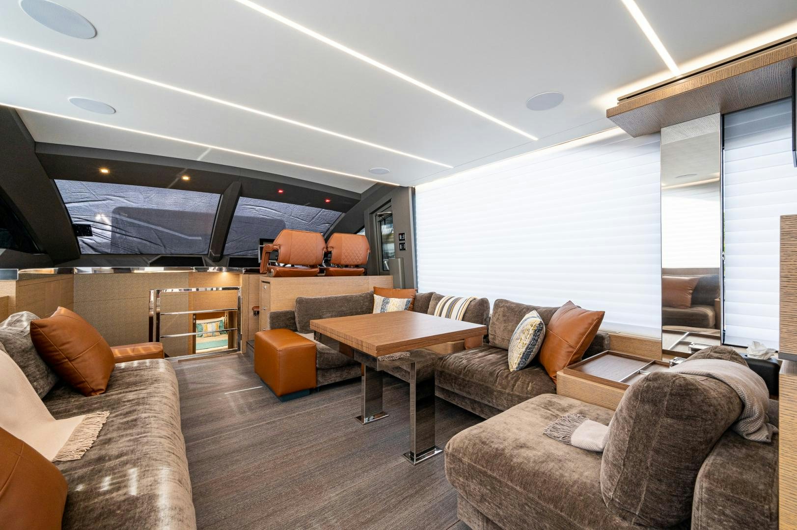 a living room with a couch and a table aboard LEBRADA Yacht for Sale