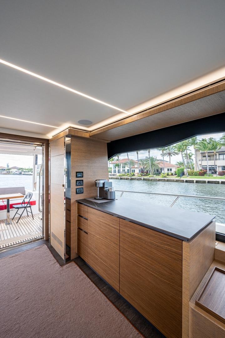 a kitchen with a large window aboard LEBRADA Yacht for Sale