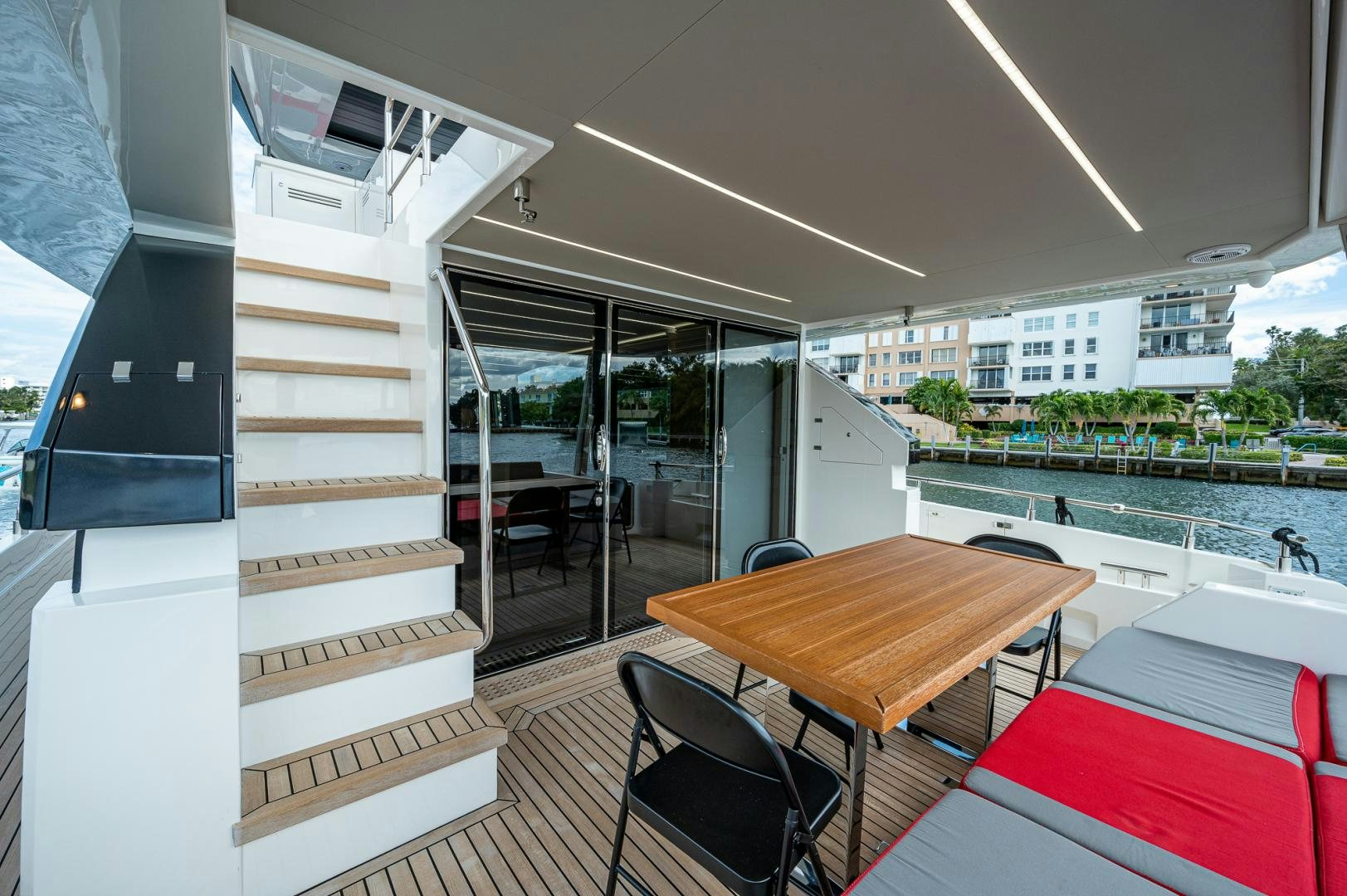 a room with a table and chairs aboard LEBRADA Yacht for Sale