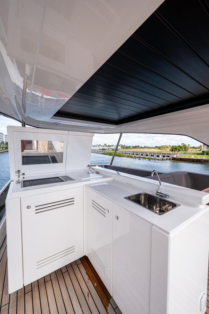 a kitchen with a sink and a window aboard LEBRADA Yacht for Sale