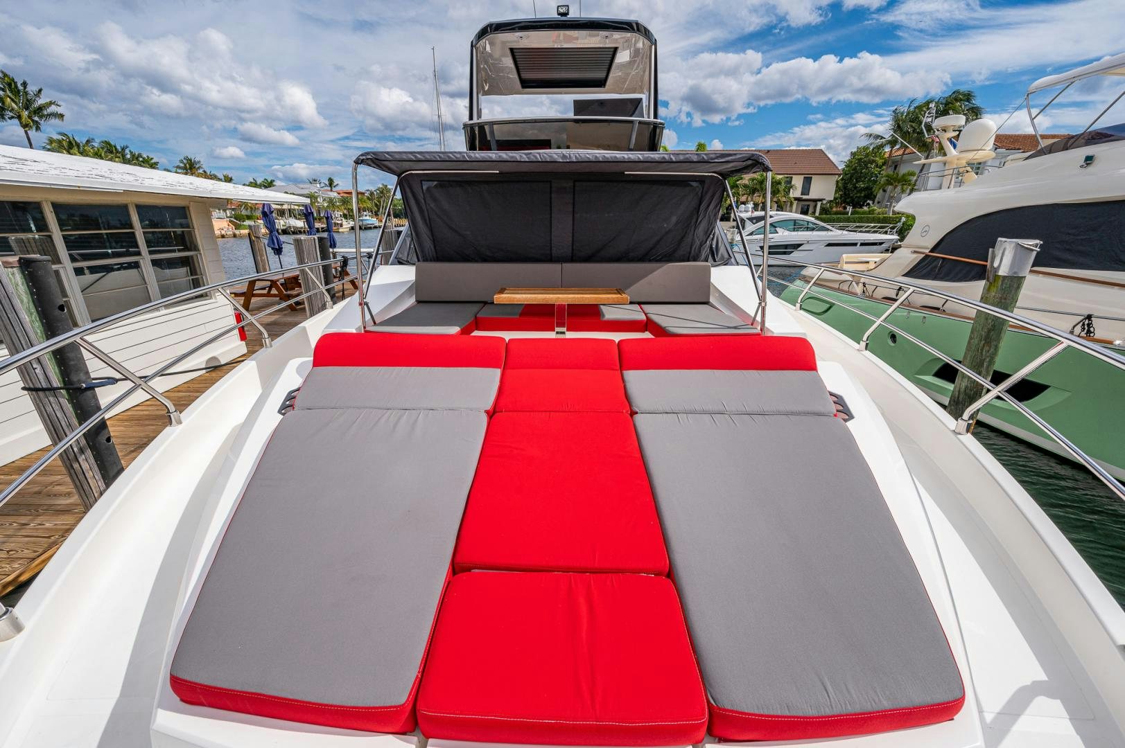 a red and white car aboard LEBRADA Yacht for Sale