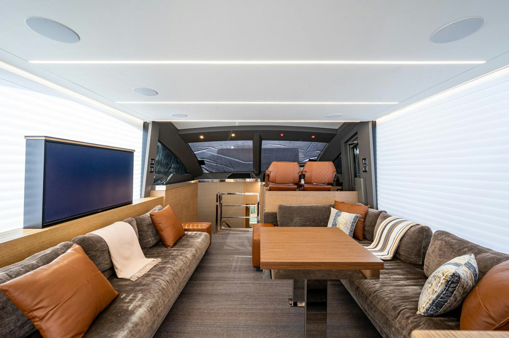 a living room with a large screen aboard LEBRADA Yacht for Sale