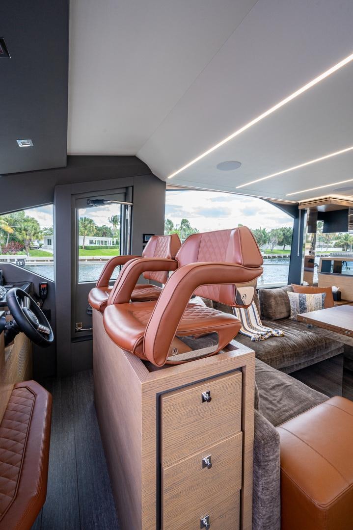 a room with a chair and a table aboard LEBRADA Yacht for Sale