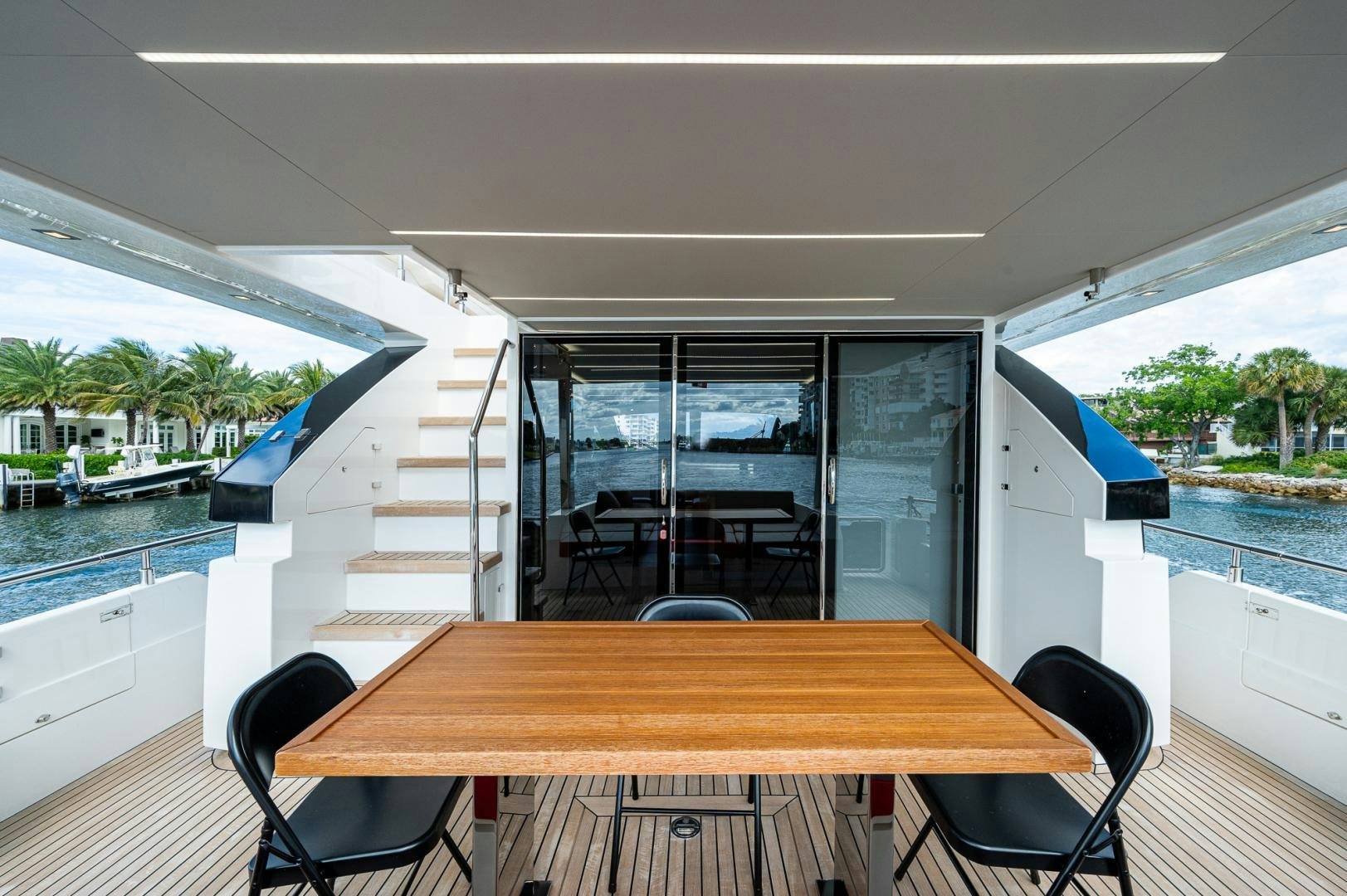 a table and chairs on a deck aboard LEBRADA Yacht for Sale