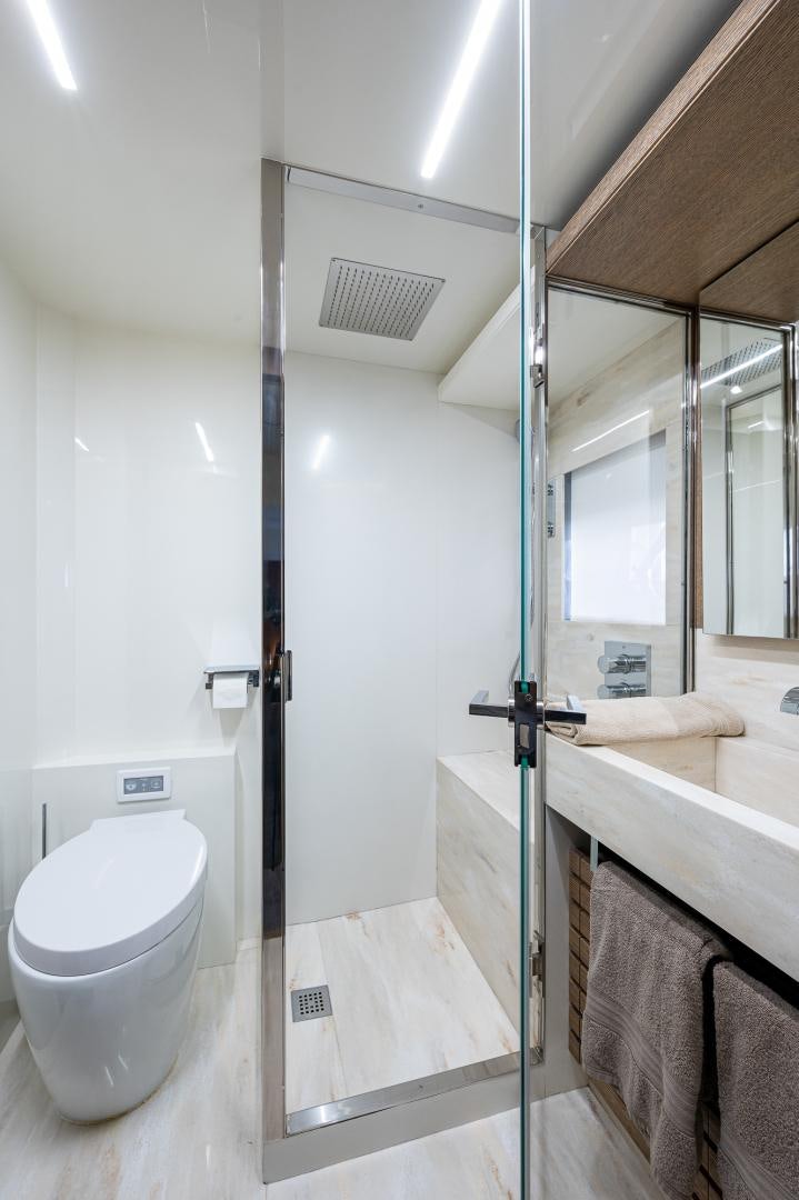 a bathroom with a toilet and a sink aboard LEBRADA Yacht for Sale
