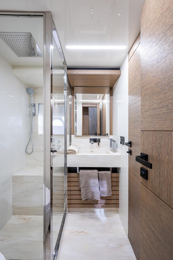 a bathroom with a glass shower aboard LEBRADA Yacht for Sale